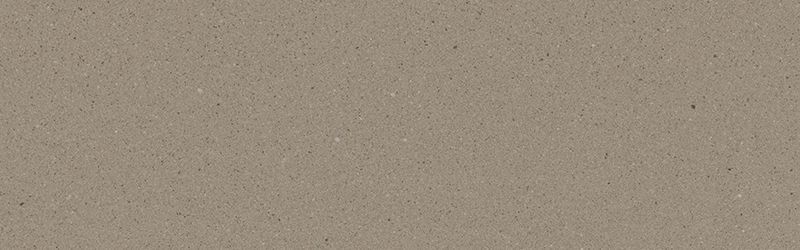 A close-up view of a textured, beige surface.