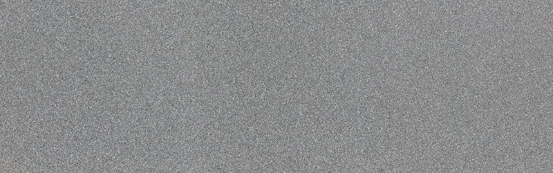 Close-up view of a textured, light gray surface.