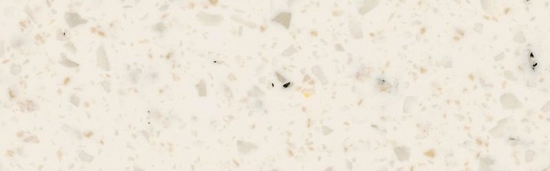 Cream-colored quartz countertop with small flecks of gray and tan.