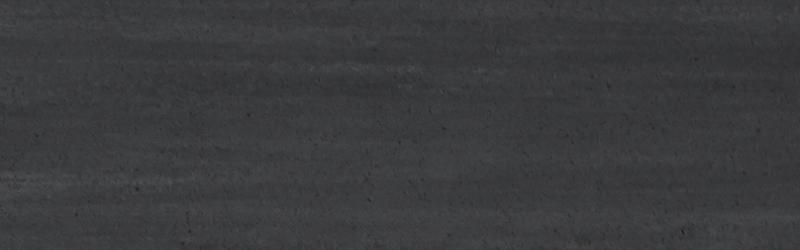 Dark gray surface with horizontal striations.