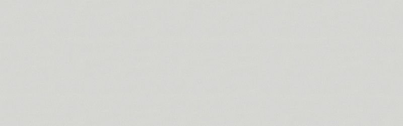 A white wall with a faint texture.