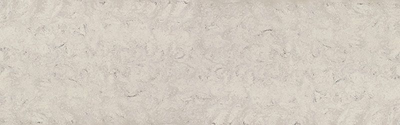 Beige paper with rough texture, dark flecks, and a mottled appearance.