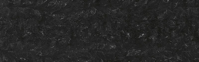 Black, textured surface with flecks of white.
