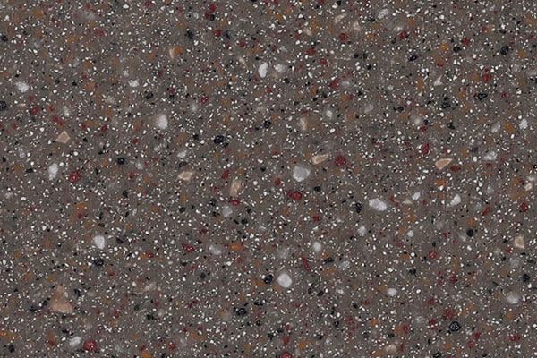 Brown speckled surface with white, red, and black flecks.