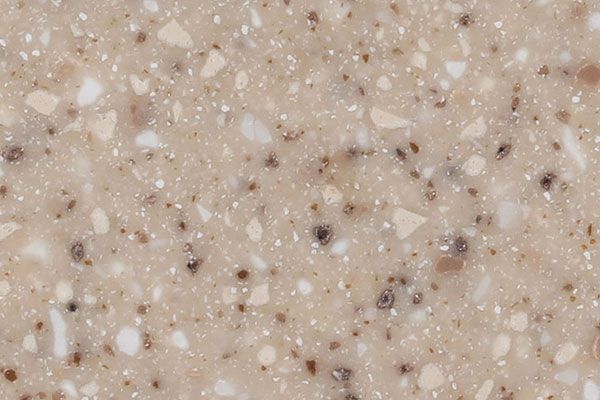 Beige speckled countertop with flecks of white, brown, and black.