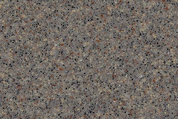 Close-up of a speckled, gray-brown countertop with flecks of black and tan.