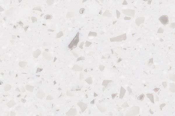 White quartz countertop with speckled, light gray and white inclusions.