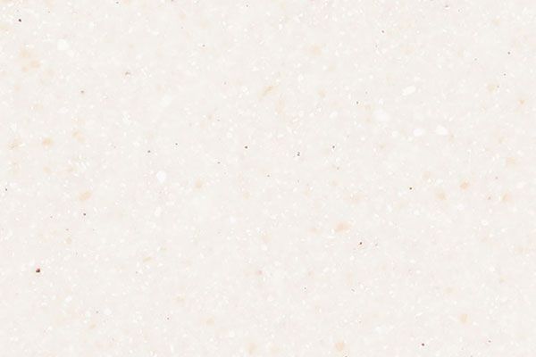 Cream-colored speckled solid surface material.
