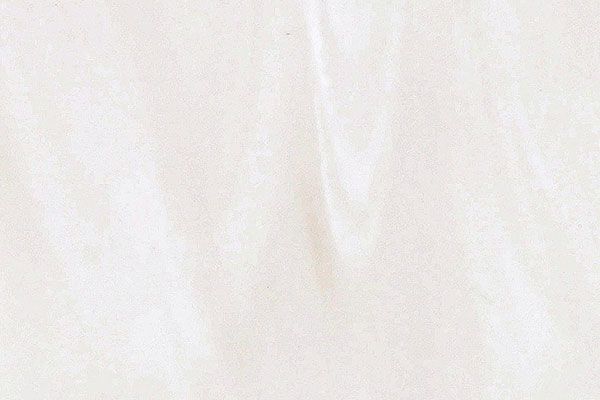Off-white, textured surface with subtle, lighter-colored swirling patterns.