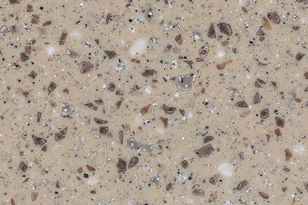 Beige countertop with flecks of brown, gray, and white.