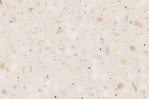 Off-white quartz countertop with speckled gray and black flecks.