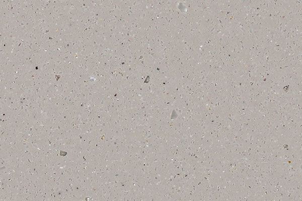 Light gray concrete surface with small flecks of color.
