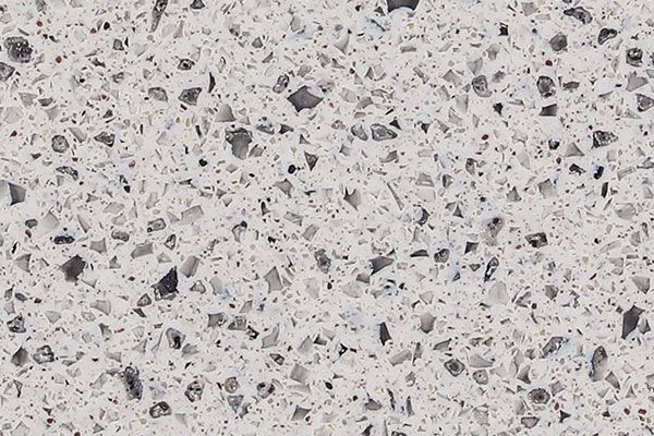 White quartz countertop with speckled gray and black flecks.