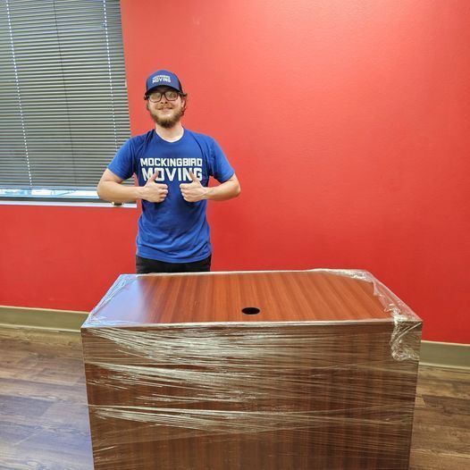 An Empty Office With Boxes And A Computer On The Floor - Fayetteville, AR - Mockingbird Moving