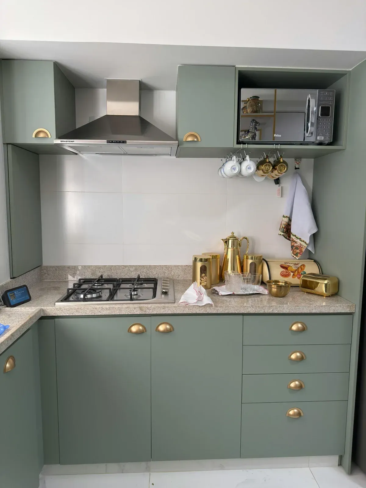 Modern bathroom with walk-in shower, wooden floor, gray sink, and large mirror.