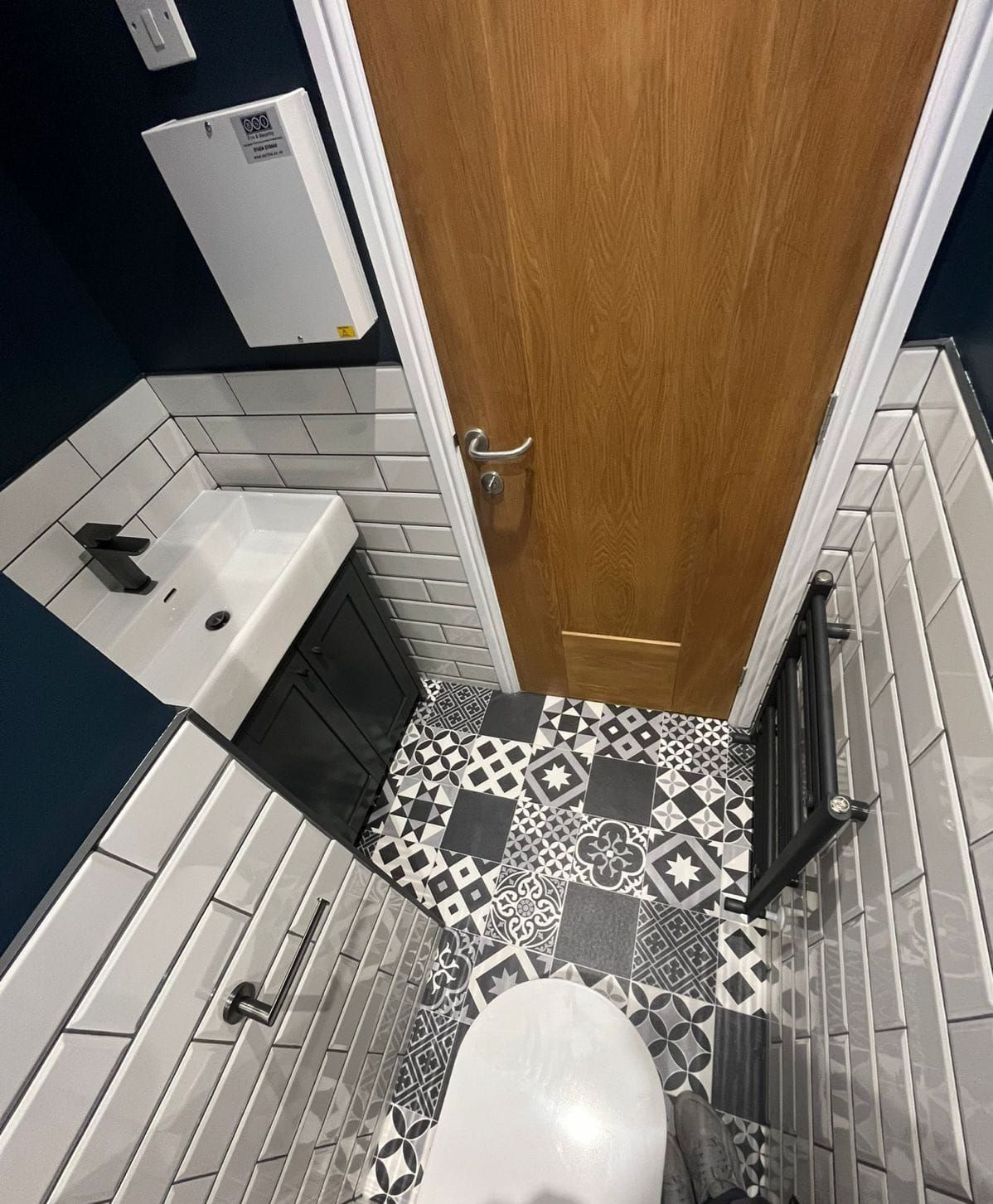 A close up of a sink faucet and hose on a table.