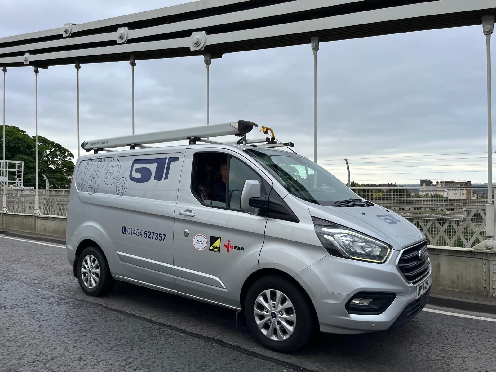 GT Heating Van driving across the Clifton Suspension Bridge at 6 am