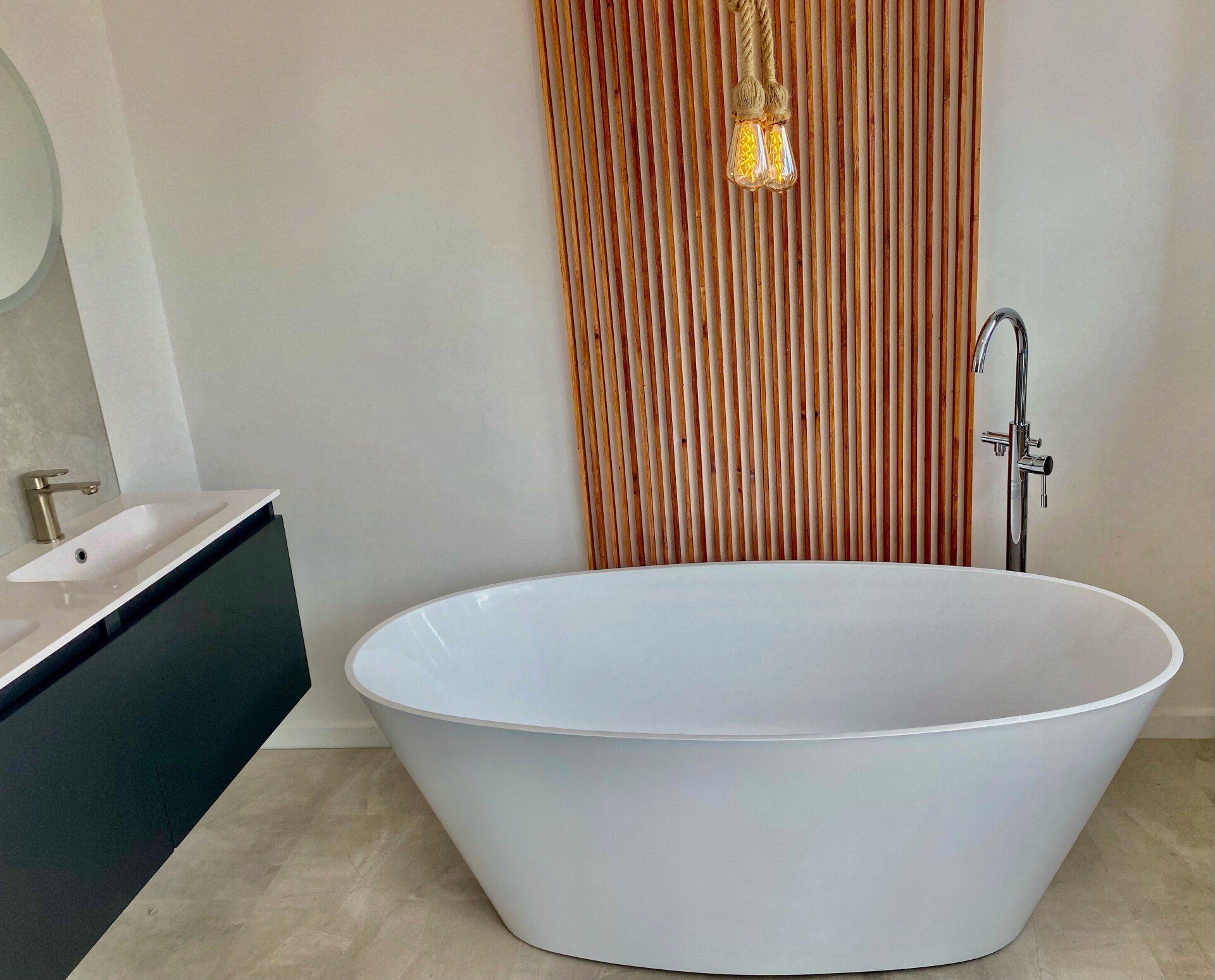 A bathroom with a bathtub and a sink