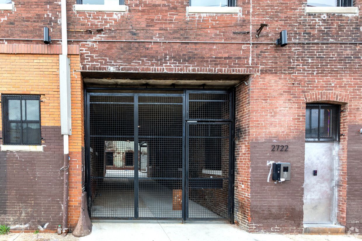 Brick breezeway with gate and callbox