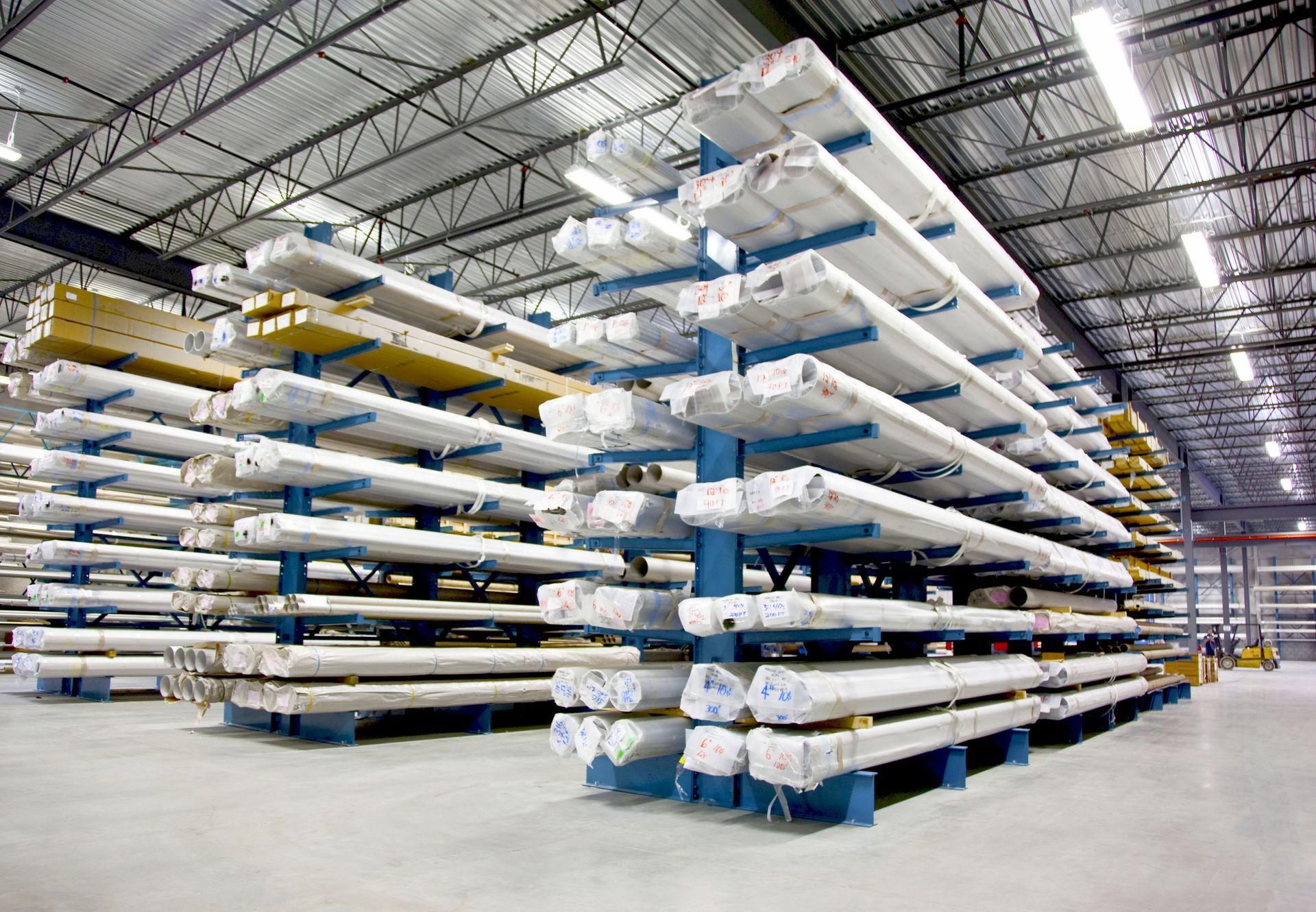 A large warehouse filled with lots of metal tubes