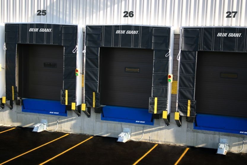 A row of loading docks with the numbers 25 26 27 on them