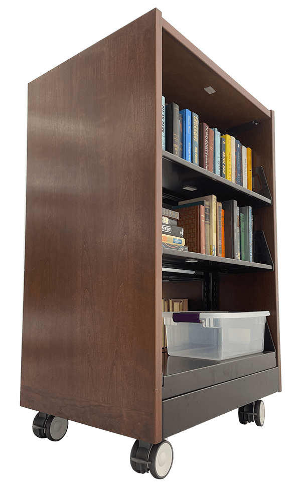 A wooden bookshelf with wheels and a plastic bin on the bottom shelf.