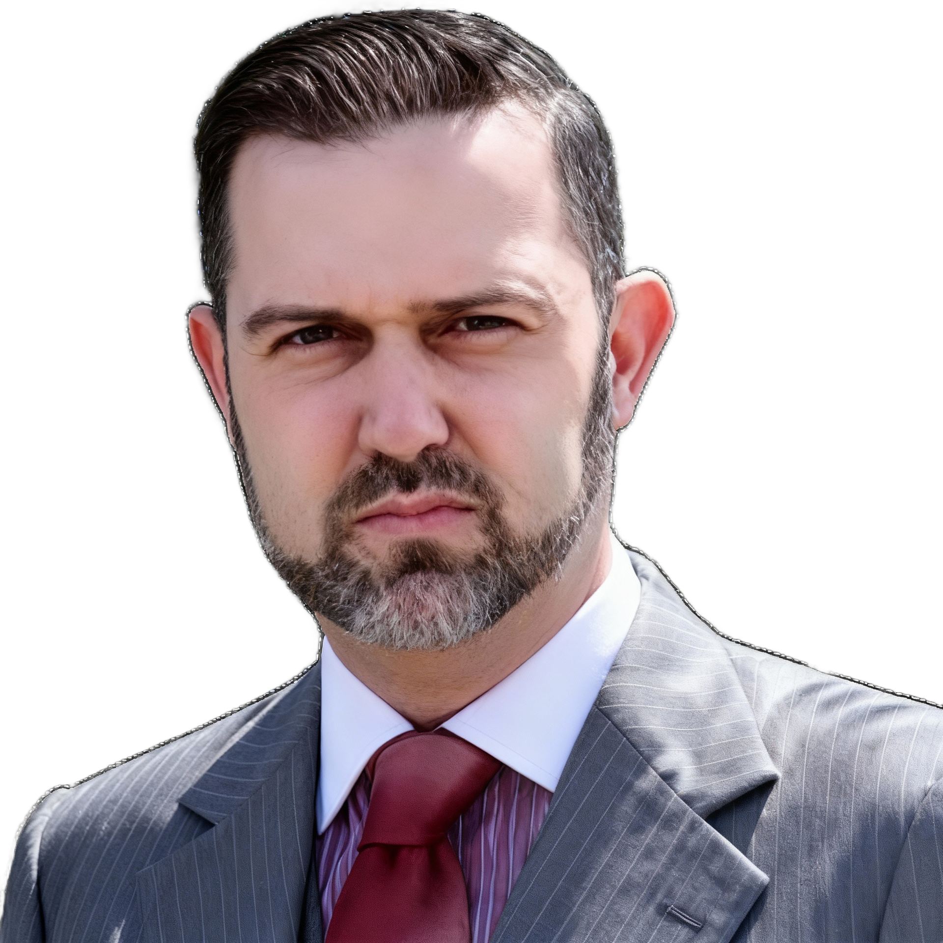 Man in gray pinstripe suit, burgundy tie, stern expression, looking over shoulder.