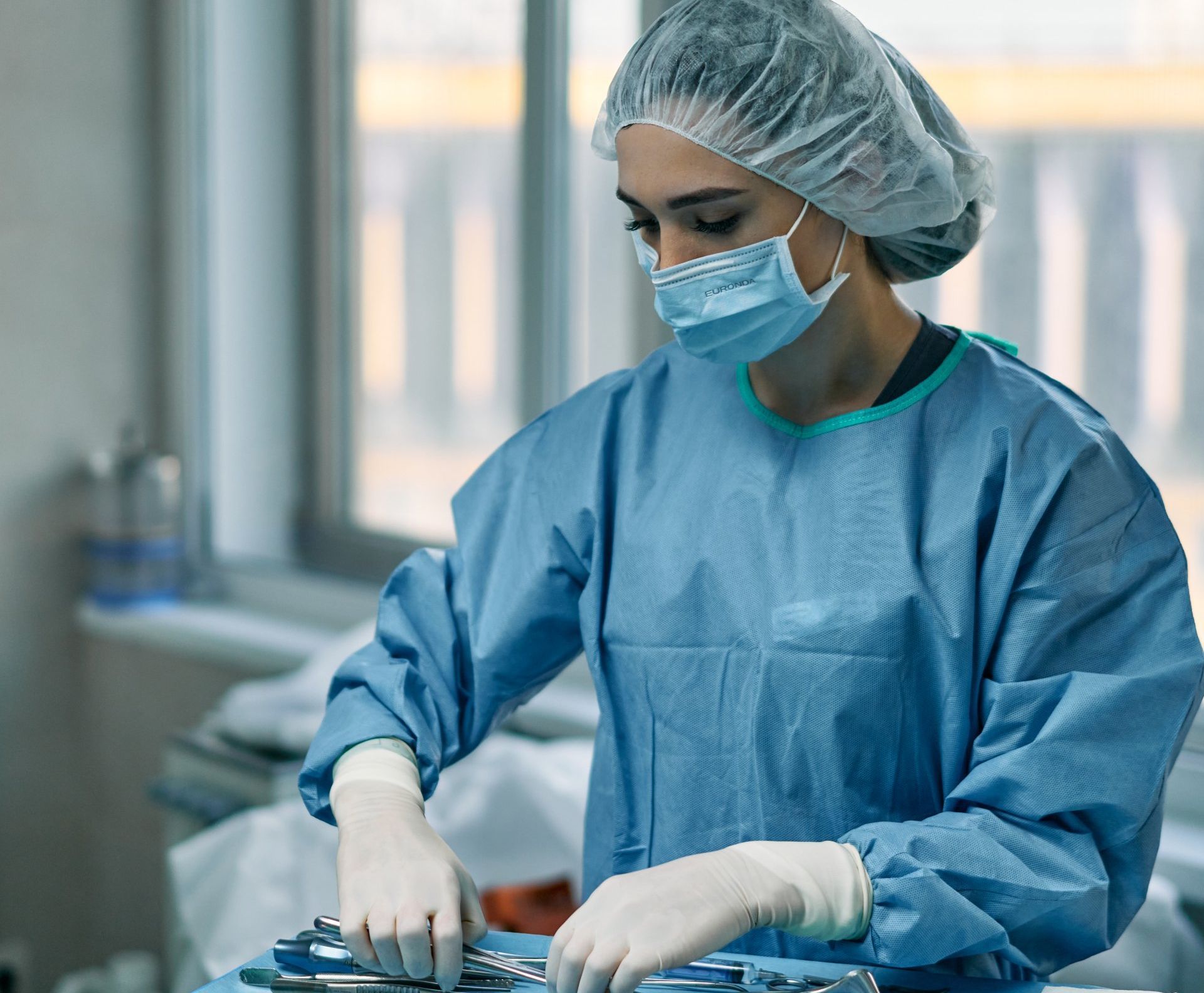 nurse in scrubs and cap