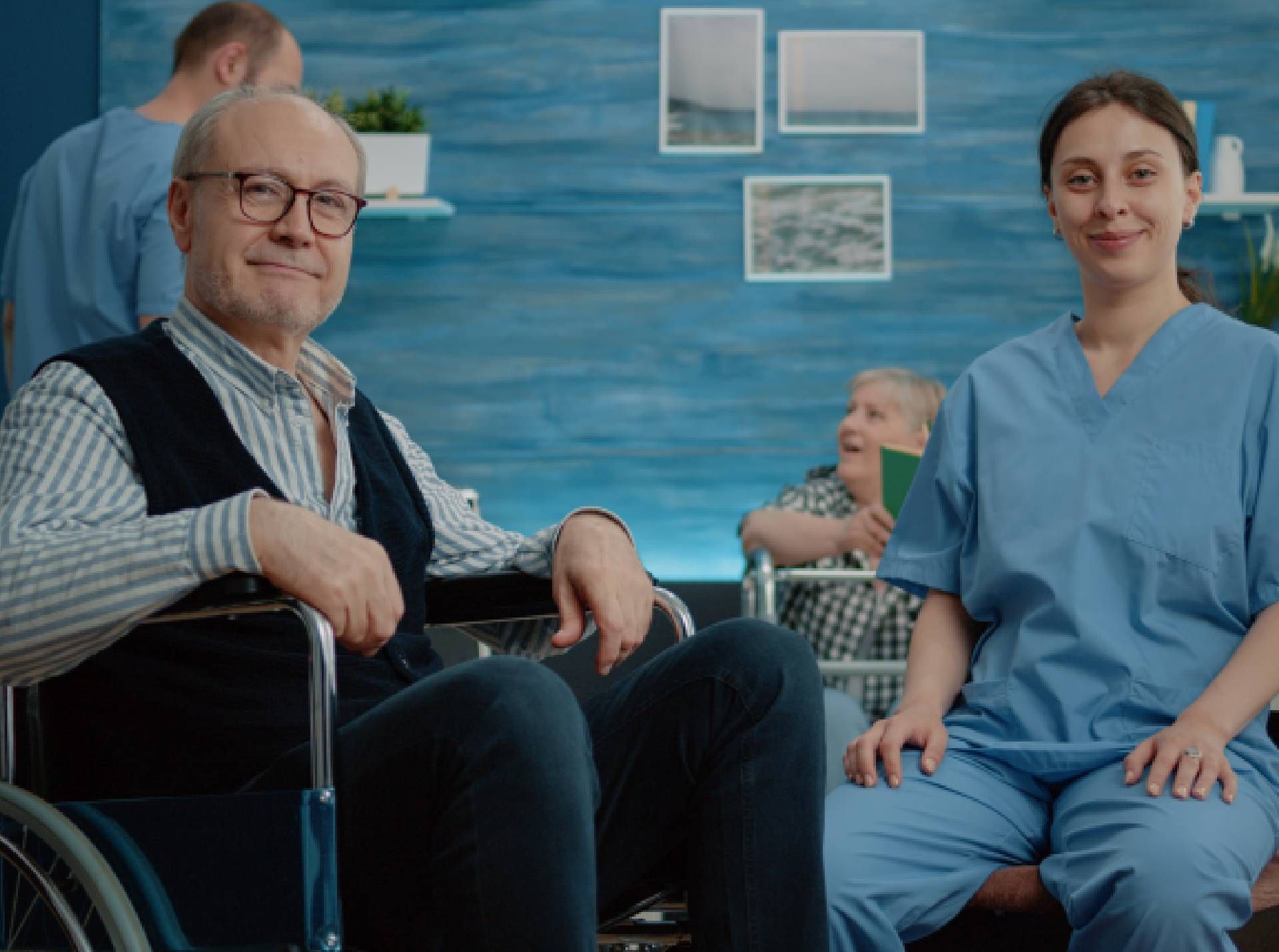 nurse with senior man in wheelchair