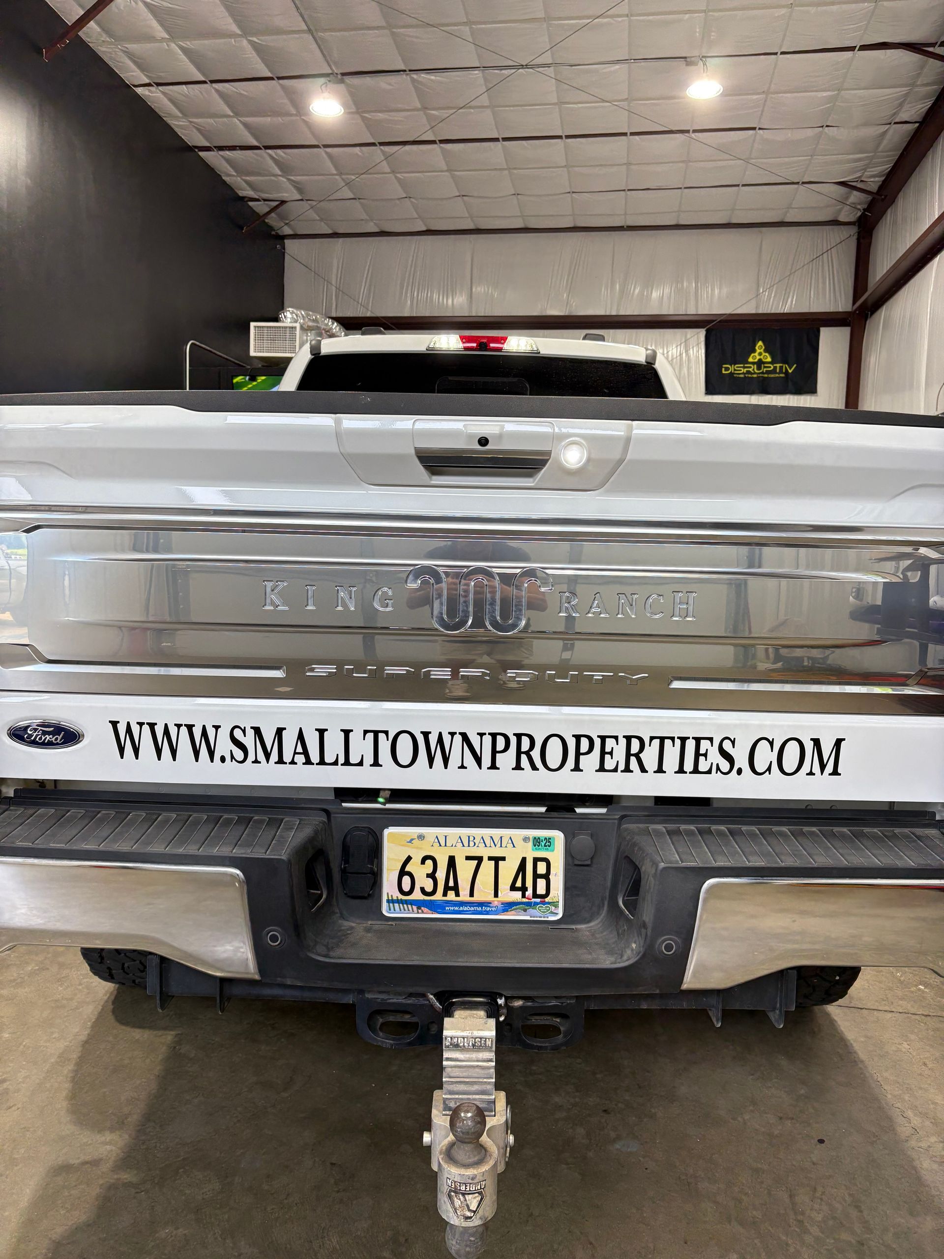 Rear view of a white pickup truck with 