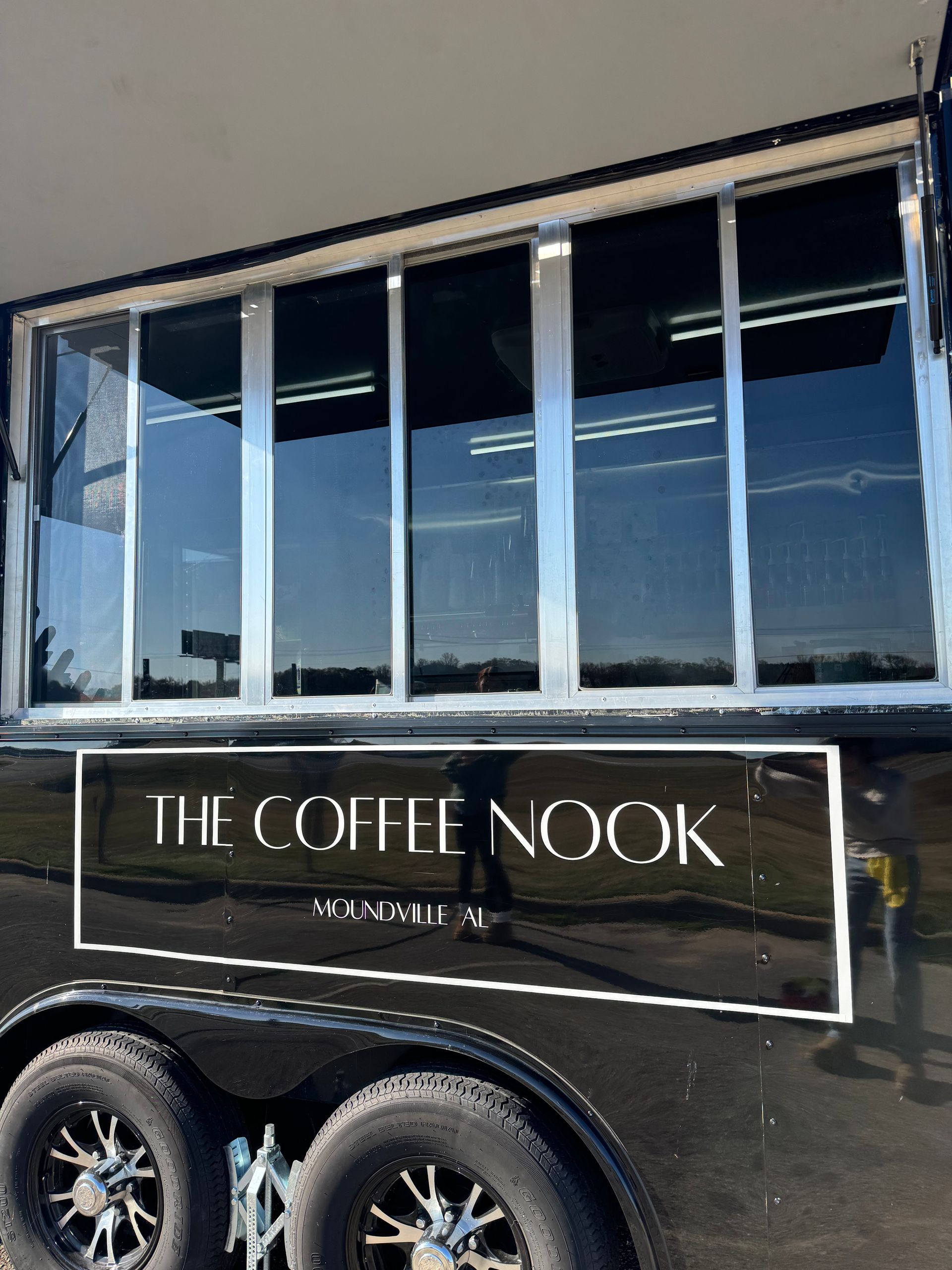 Black coffee trailer with large windows and 
