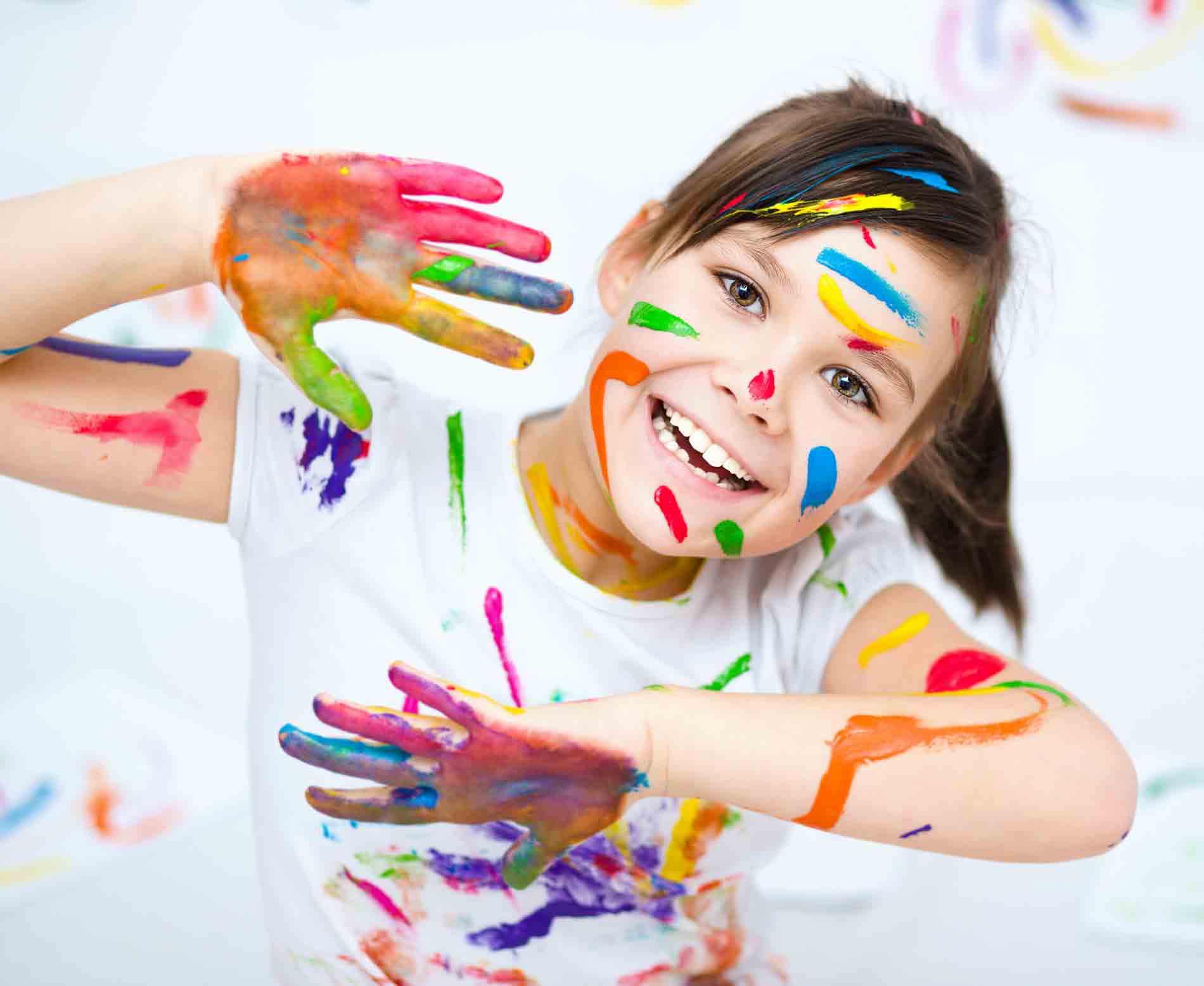 little girl playing with paint