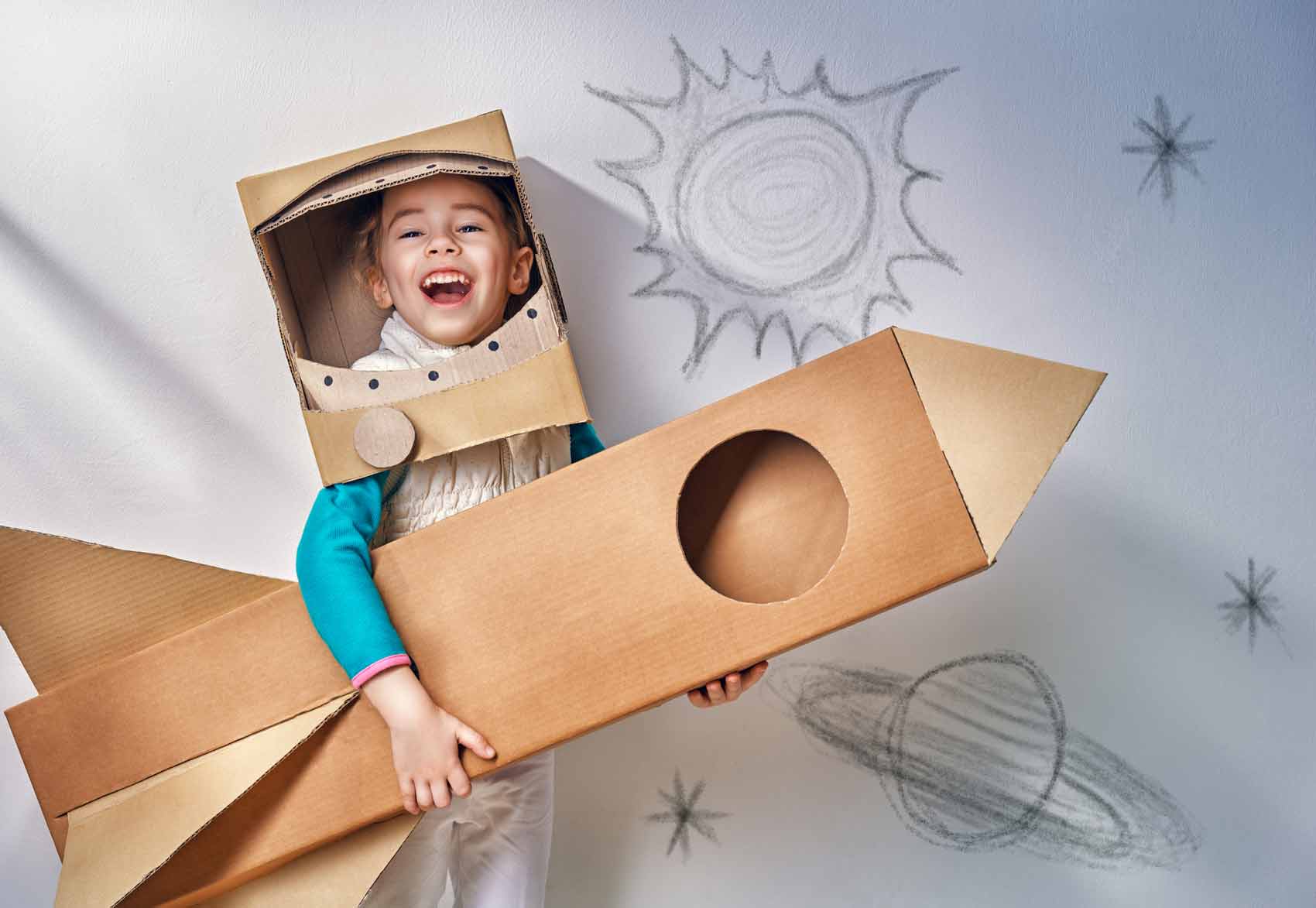little boy playing with a rocketship