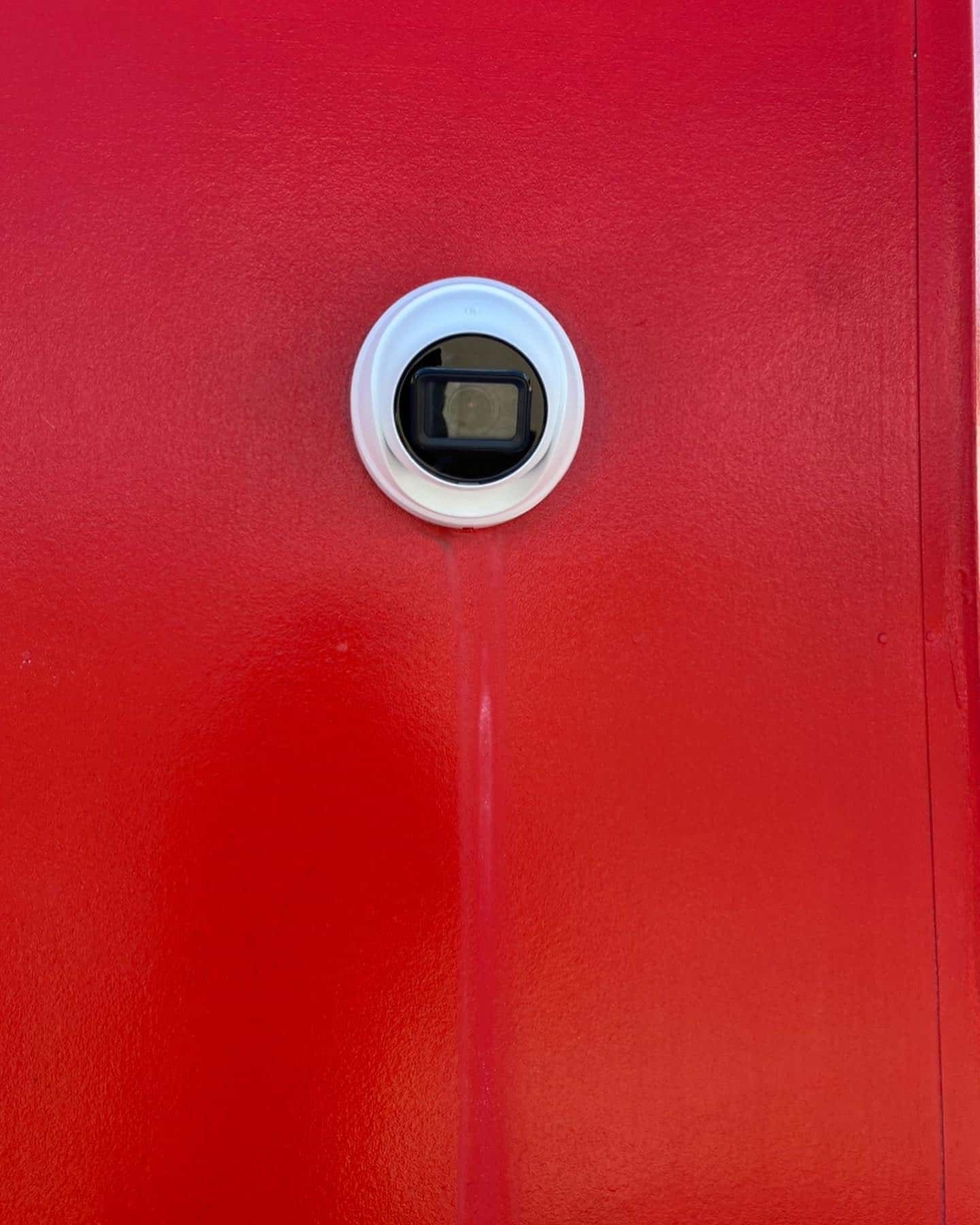 A Red Door With a White Circle on It — DGC Tech Solutions In Tablelands, QLD
