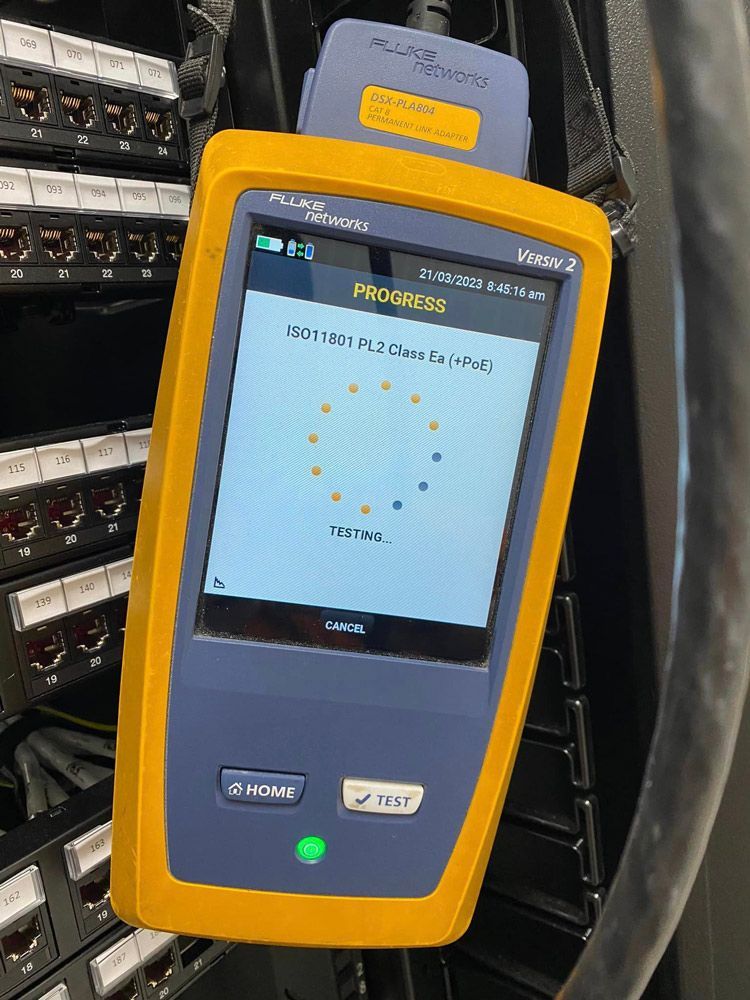 A Yellow and Blue Device is Sitting on Top of a Server Rack — DGC Tech Solutions In Mareeba, QLD