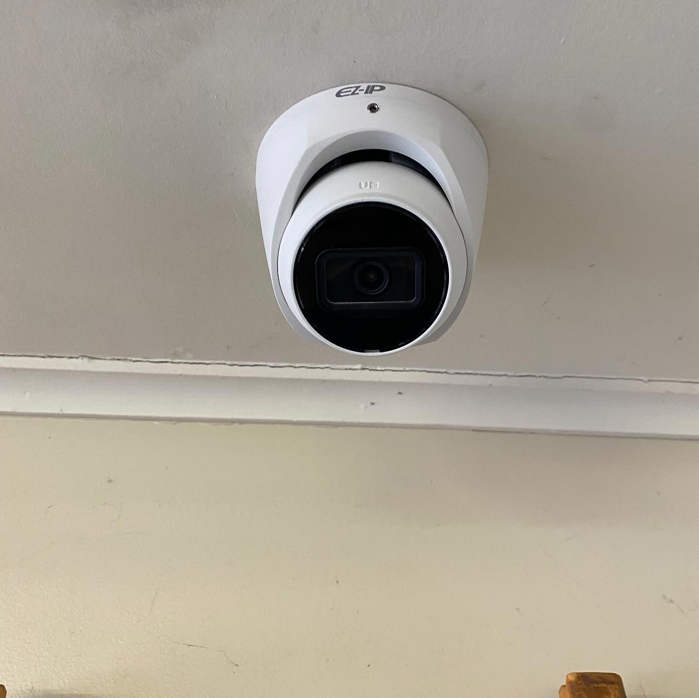White Security Camera Installed at Ceiling