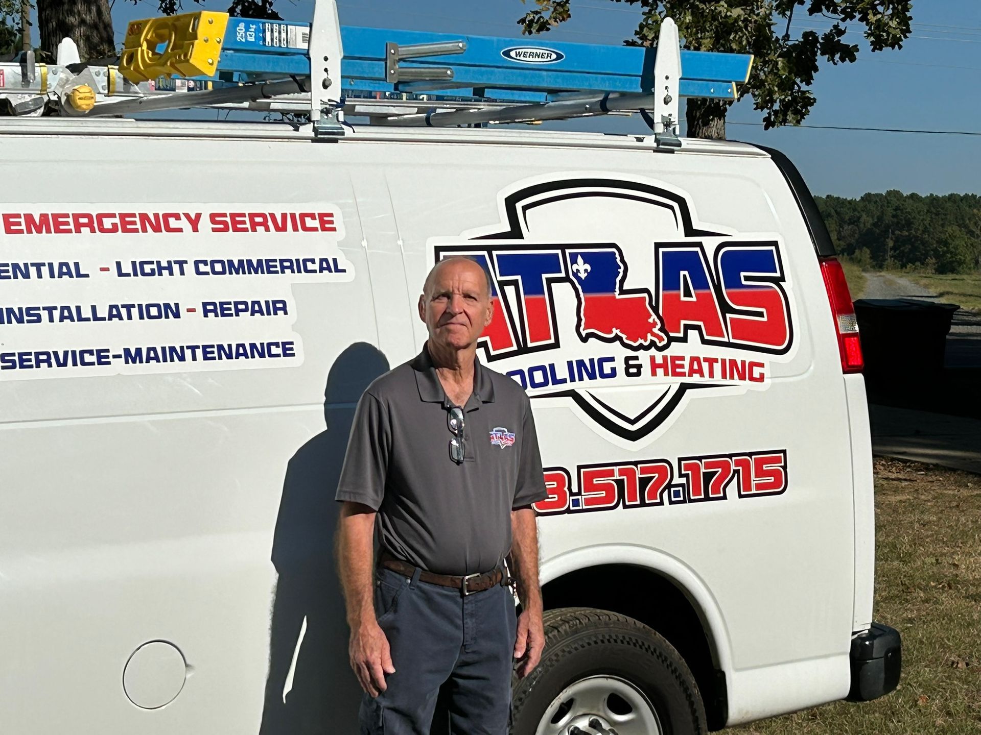 Man standing next to white van with 