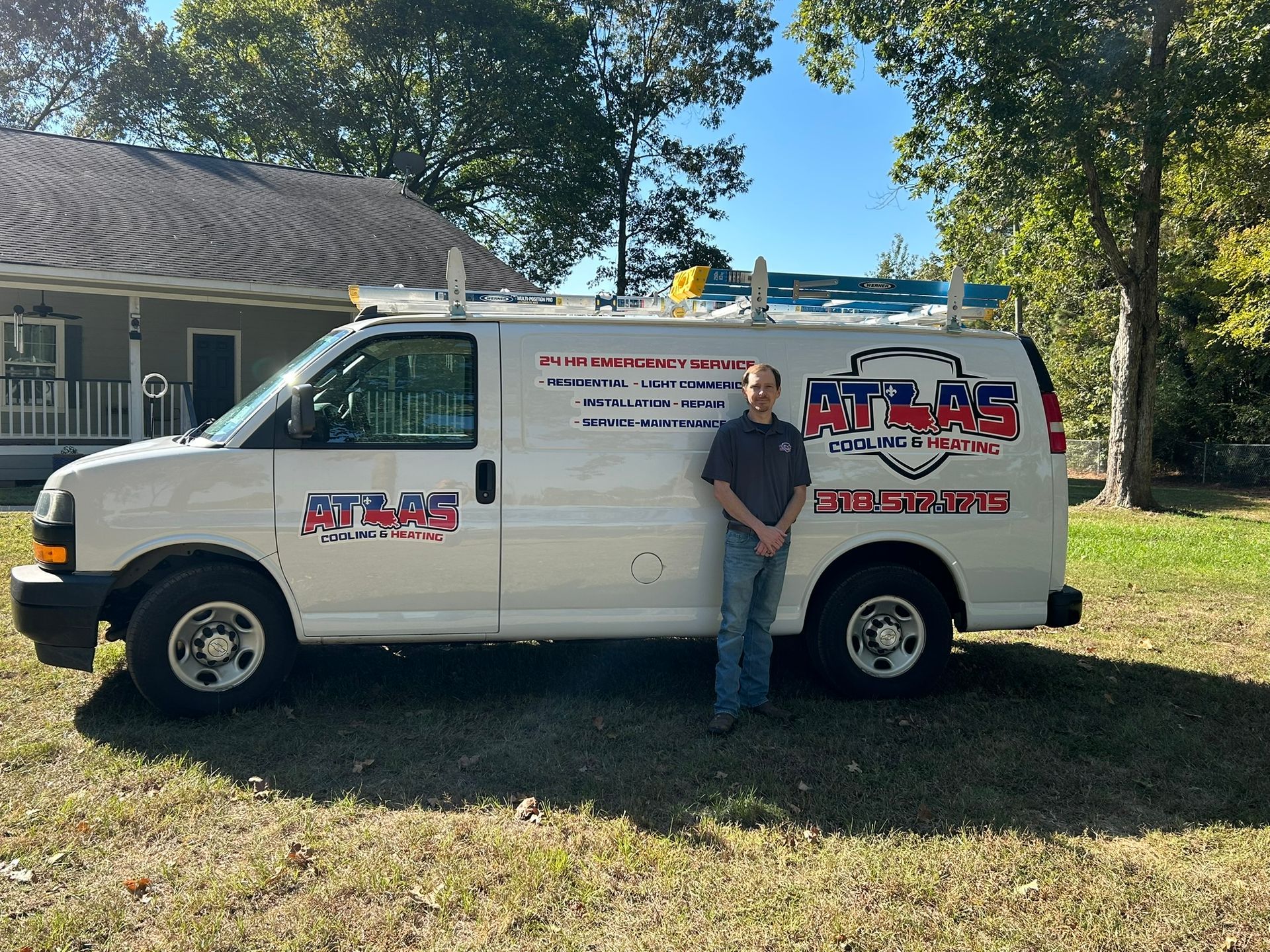 Man standing next to a white service van, 