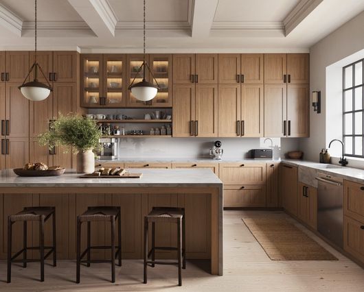 A kitchen with wooden cabinets and a large island