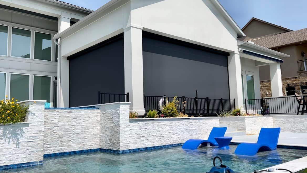 A large house with a swimming pool in front of it.