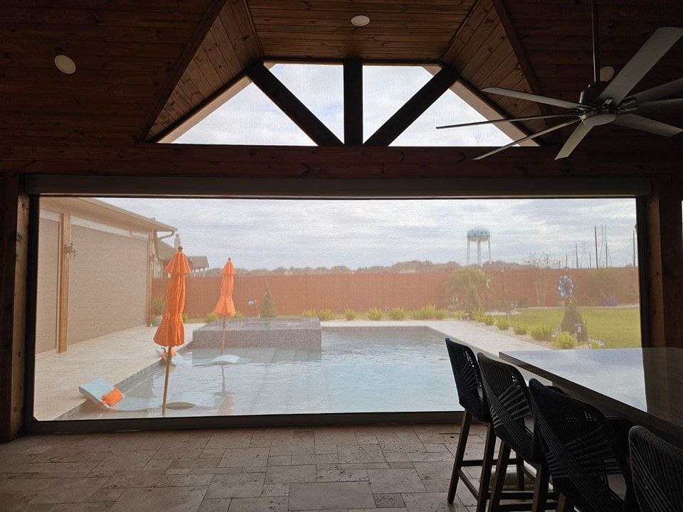 A large window with a view of a swimming pool