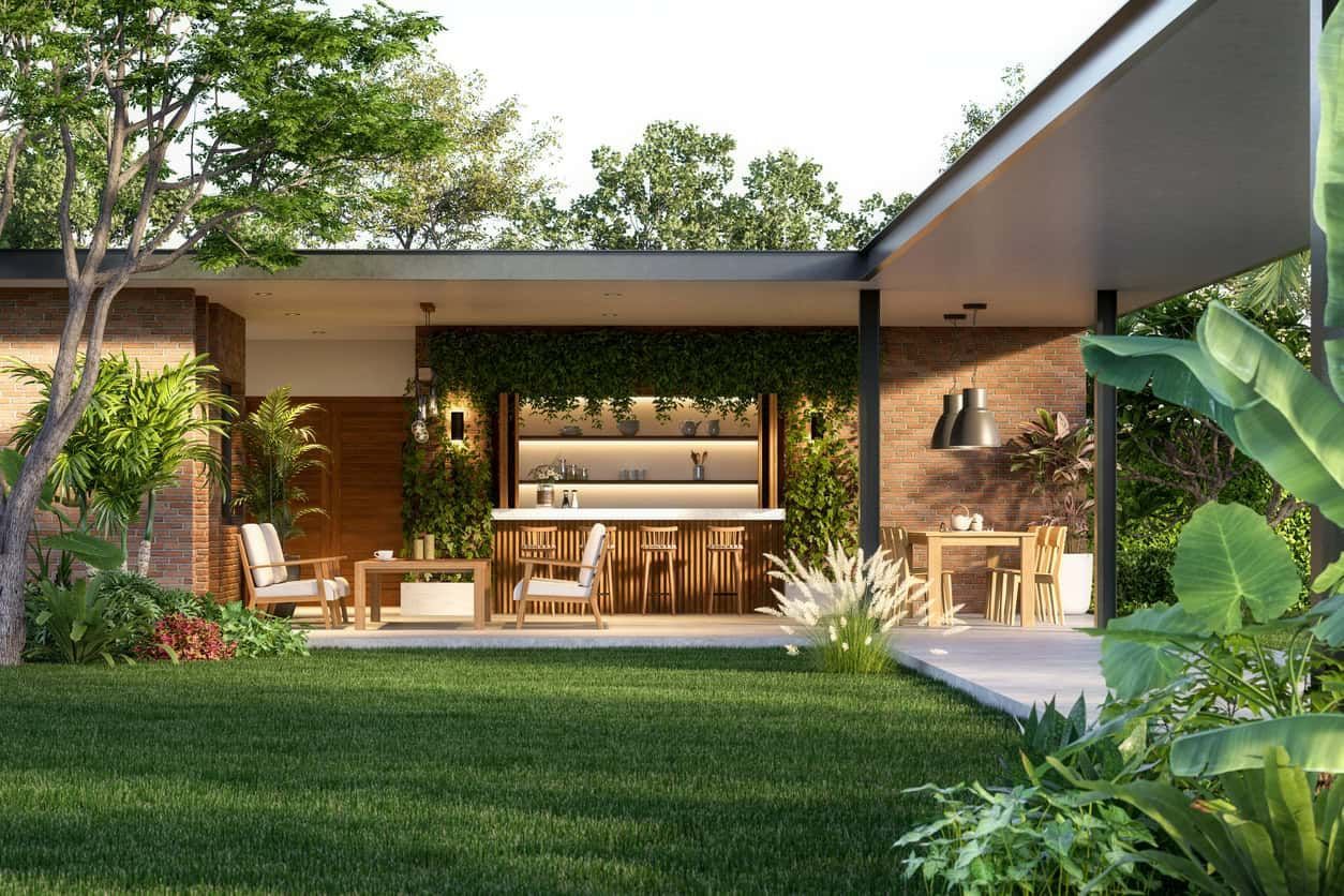 Modern contemporaty loft style house with green lawn 3d render surrounded by tropical nature, sunlig