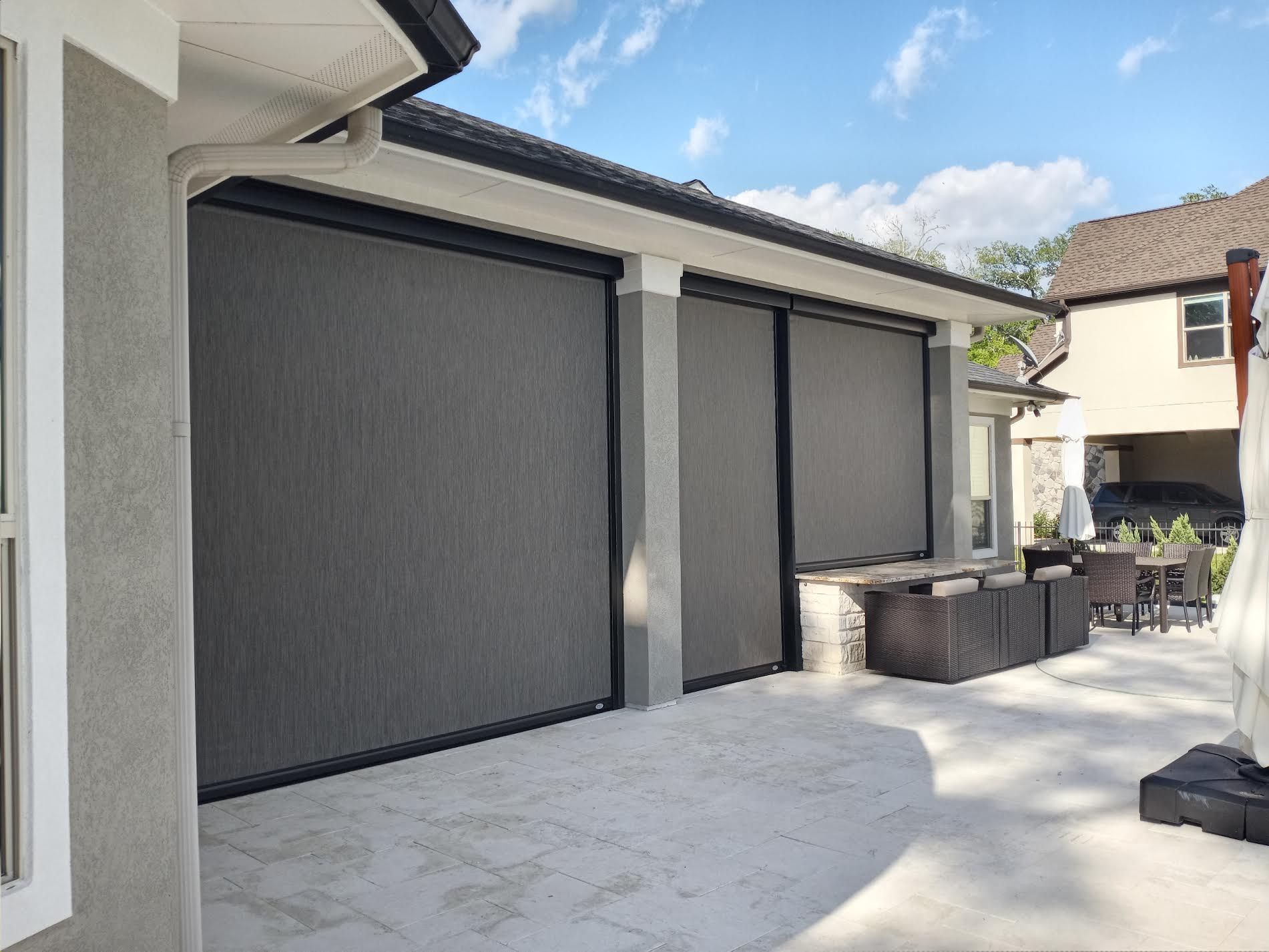 A house with a patio and a screened in porch.