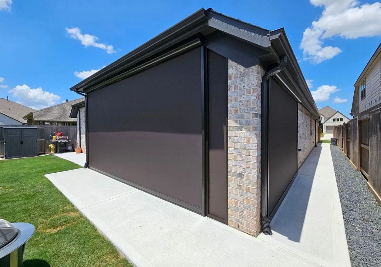 A hot tub on a deck with an awning over it