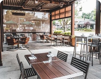 large swimming pool in the backyard of a house with motorized patio shades texas
