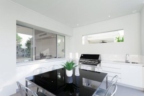 modern kitchen with dining table and chairs