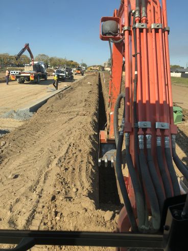 excavator removing gravel from the ground
