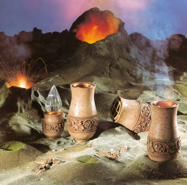 Urne funerarie in Stonat, inserite in un contesto decorato che ricorda un  insieme di vulcani in eruzione