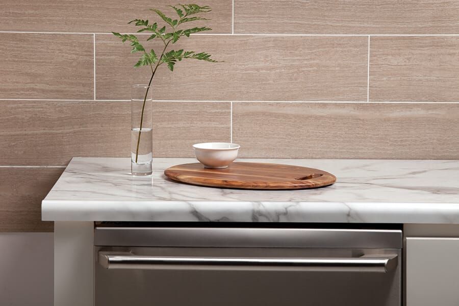 A large kitchen with a large island in the middle of it and hardwood floors.