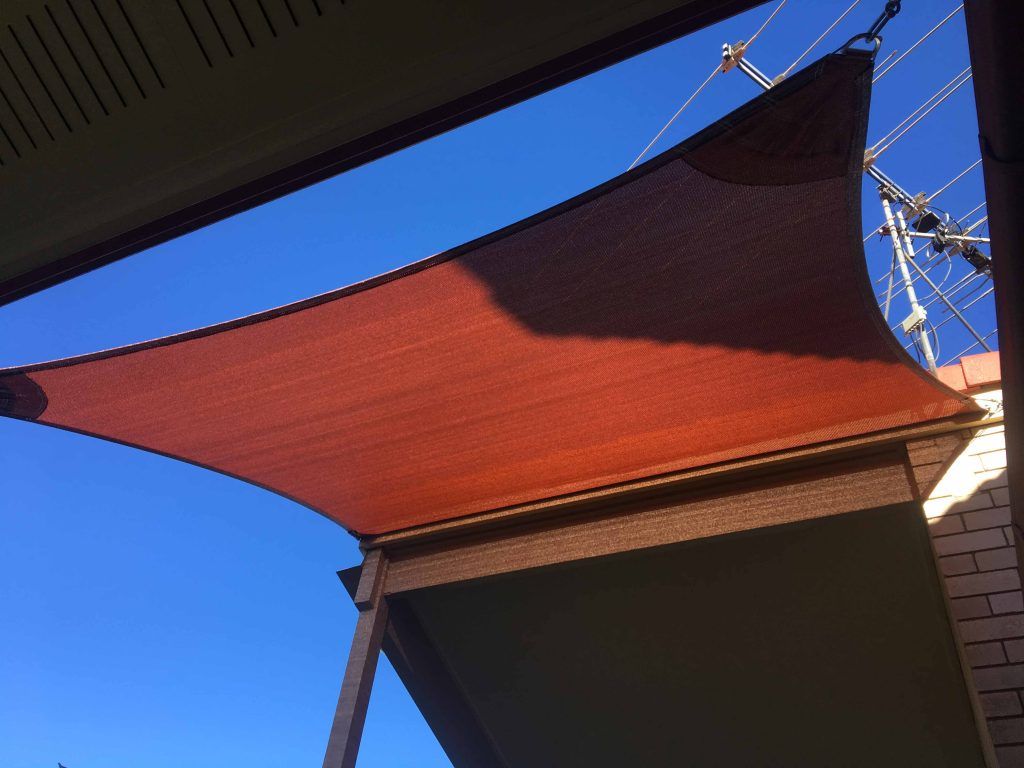 House with red shade sail — Benefits of Shade Sails For Your Business in Buderim, QLD